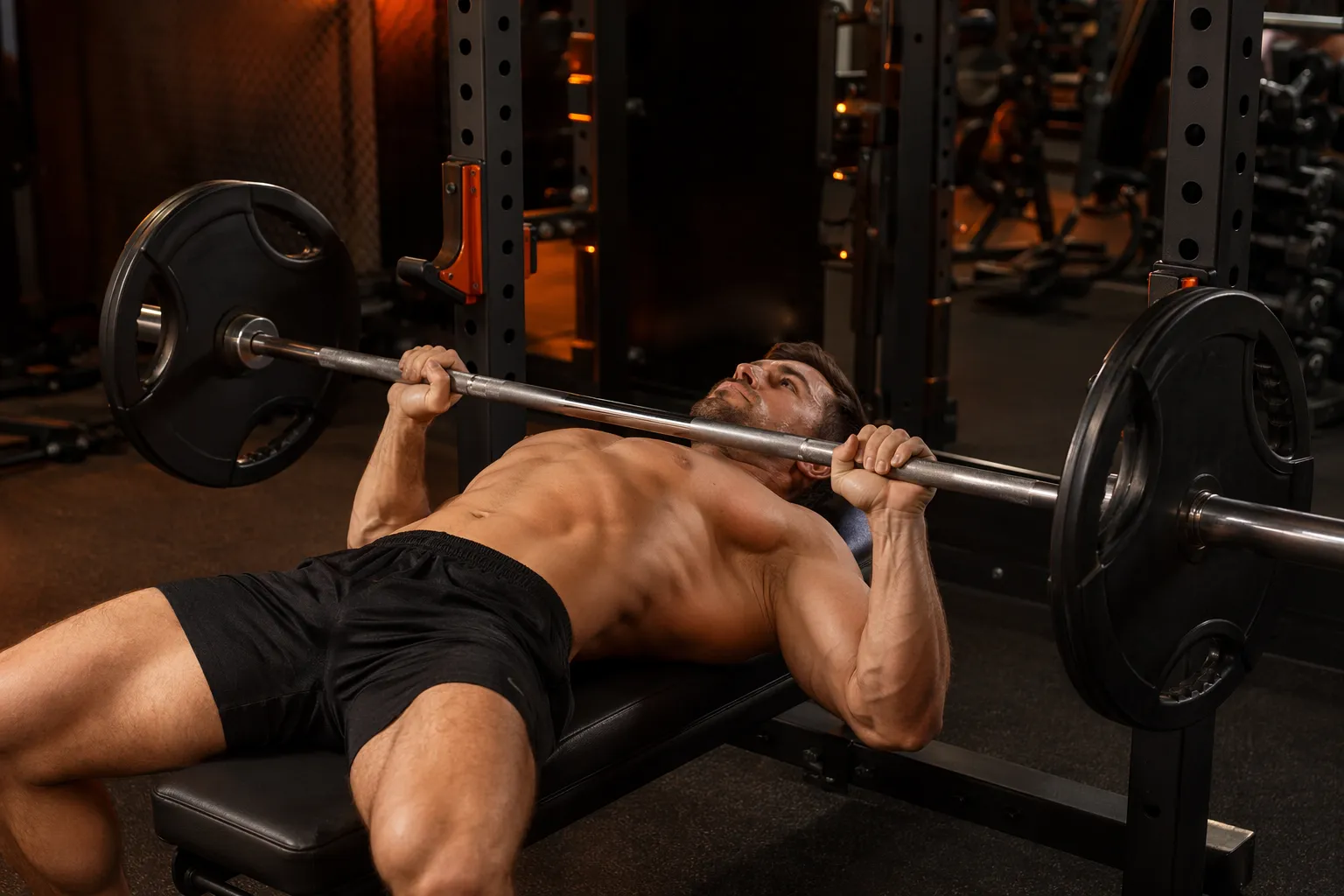 Athlete performing flat barbell bench press with shoulder blades retracted and feet planted
