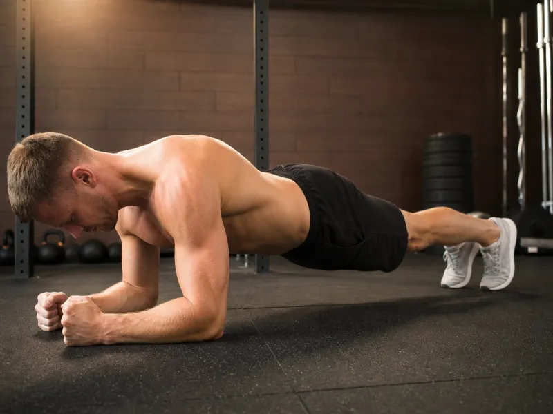 Athlete demonstrating incorrect plank form with sagging hips and arched lower back